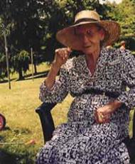 Maw wearing one of her hats at an outdoor BBQ.